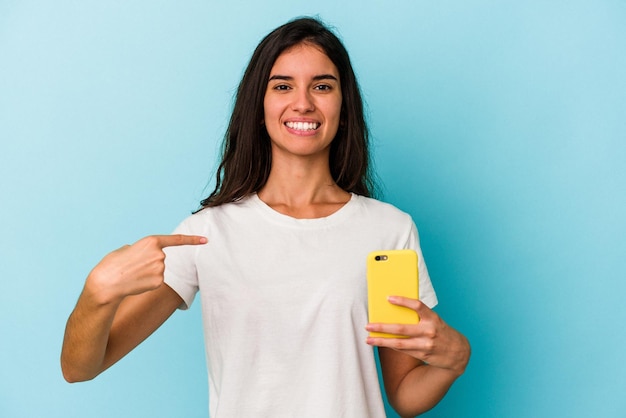 Person pointing by hand to a shirt copy space proud and confident