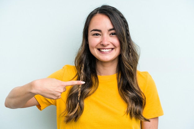 Person pointing by hand to a shirt copy space proud and confident