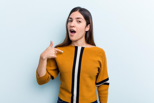 Person pointing by hand to a shirt copy space proud and confident