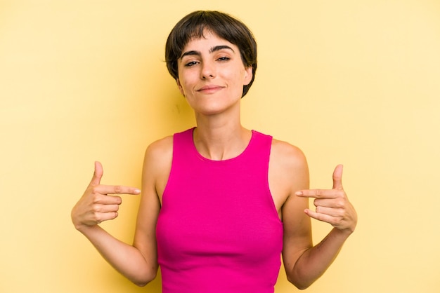 Person pointing by hand to a shirt copy space proud and confident