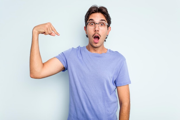 Person pointing by hand to a shirt copy space proud and confident