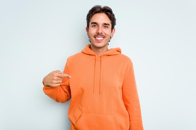 Person pointing by hand to a shirt copy space proud and confident