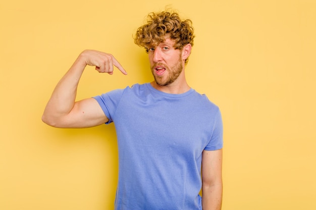 Person pointing by hand to a shirt copy space proud and confident