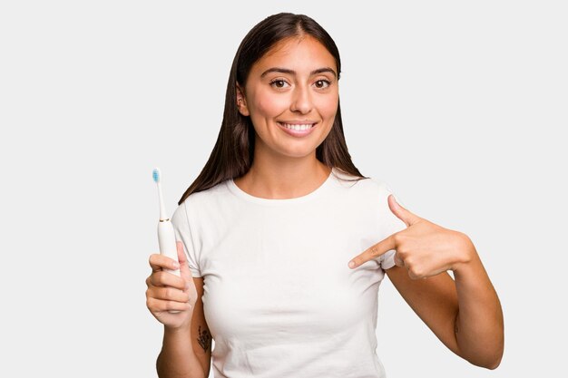 Person pointing by hand to a shirt copy space proud and confident