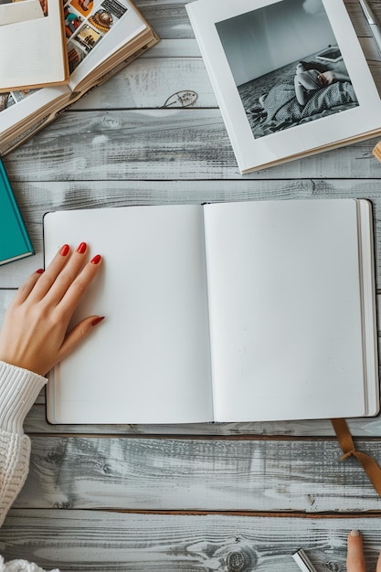 Photo person pointing at open blank book on table home journal writing scene