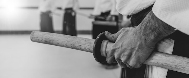 Person practicing aikido in a dojo background