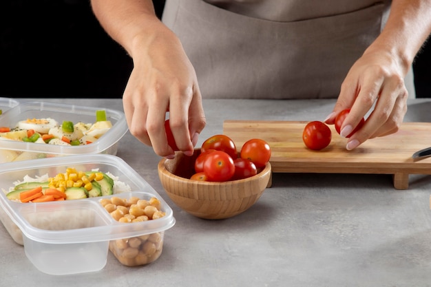 Person practicing batch cooking with healthy food