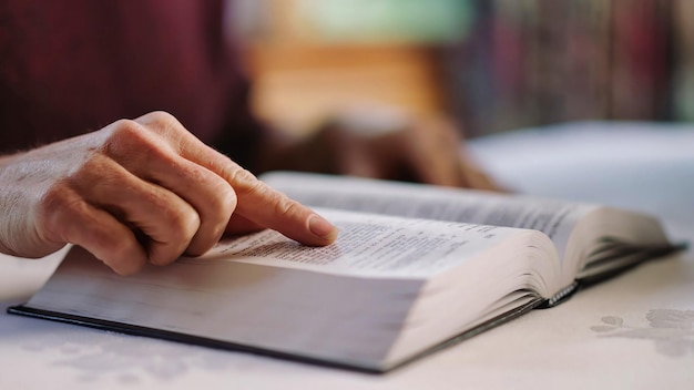 A person reading a book with the word reading on the left side.