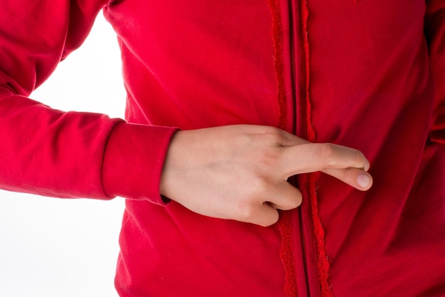 A person in a red jacket with the word stop on the left hand