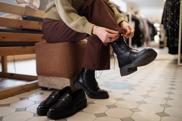 Person searching for shoes in second hand market