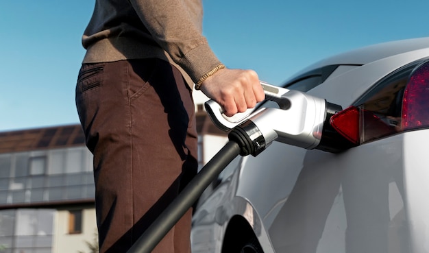 Person taking care of electric car