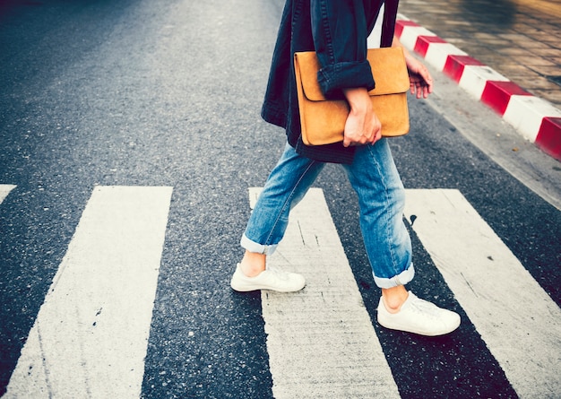 Photo person walking across pedestrian lane