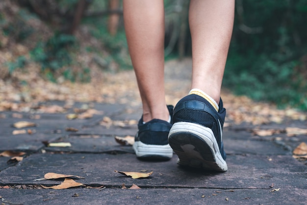 Person walking and close up of shoes with copy space