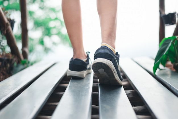 Person walking and close up of shoes with copy space