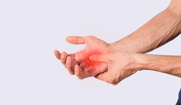 Person with palm pain concept of a man with pain in the hands man with arthritis rubbing person with pain in the hands