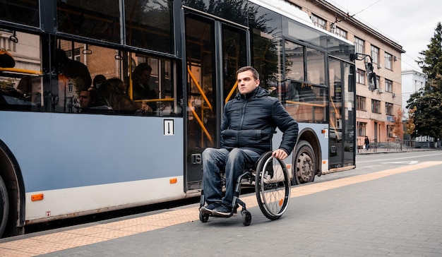 Person with a physical disability exits public transport with an accessible ramp