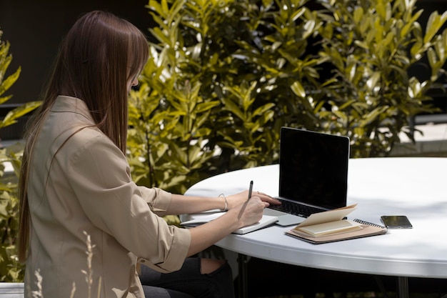 person working on laptop in the park