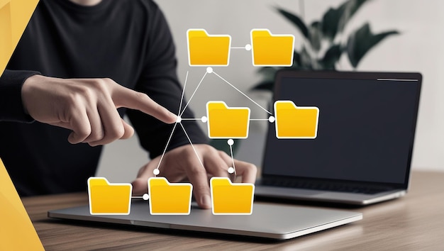 Photo a person39s hand hovers over a laptop pointing at a virtual file hierarchy of folders connected by lines