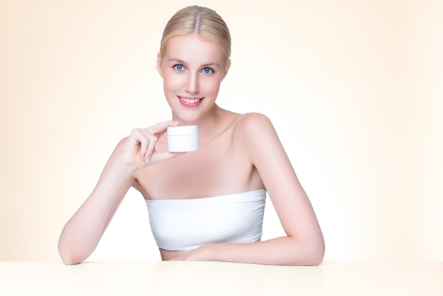 Personable perfect skin woman holding mockup moisturizer product