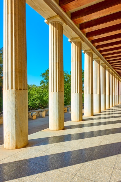 Perspective of colonnade of marble classical columns, Athens, Greece