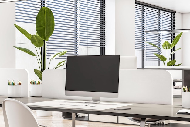 Perspective view on blank black monitor on dark table with white partition in sunlit coworking office 3D rendering mock up