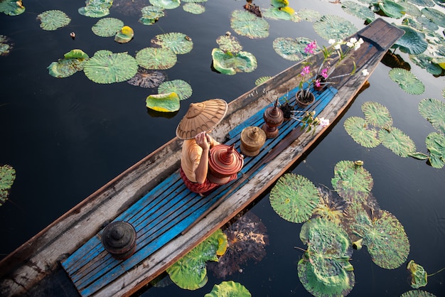 Peson is taking boat from a shanty town by riverbank of Irrawaddy River to the City