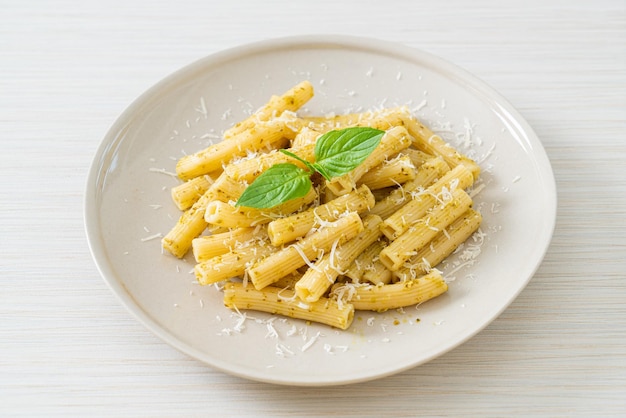 pesto rigatoni pasta with parmesan cheese