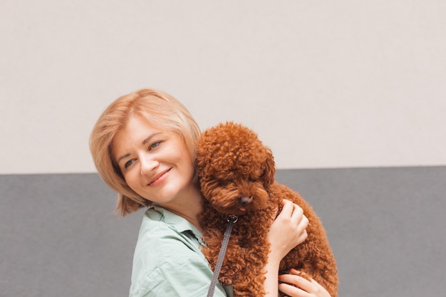 Pet parent concept Portrait of woman with cute dog