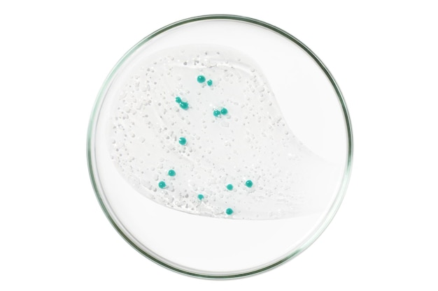 Petri dish isolated on empty background A smear of a transparent gel serum in a Petri dish