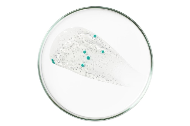 Petri dish isolated on empty background A smear of a transparent gel serum in a Petri dish