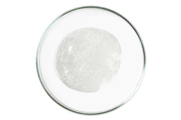 Petri dish isolated on empty background A smear of a transparent gel serum in a Petri dish