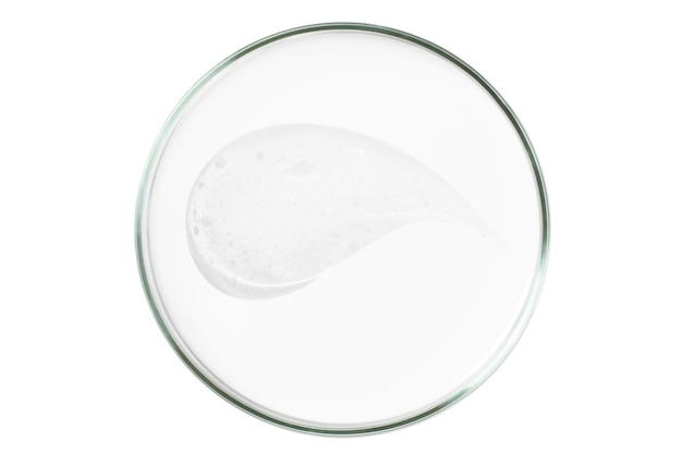 Petri dish isolated on empty background A smear of a transparent gel serum in a Petri dish