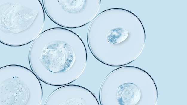 Petri dishes and drops and ointments of transparent gel or serum on a blue background Banner with empty space for advertising