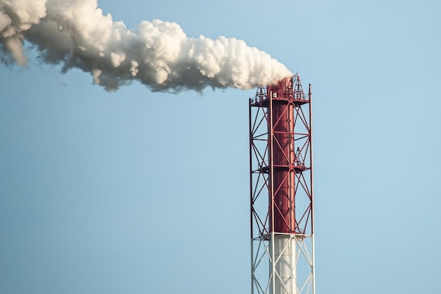 Petrochemical industrial factory of heavy industry power refinery production with smoke pollution Thick smoke is coming from the factory's chimney