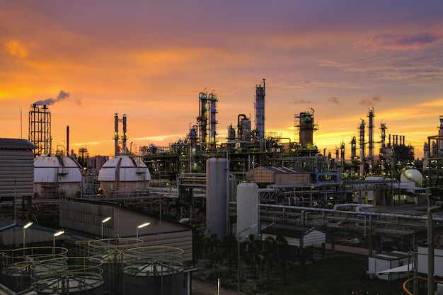 Petrochemical industry plant at sunset, Manufacturing of oil refinery industrial