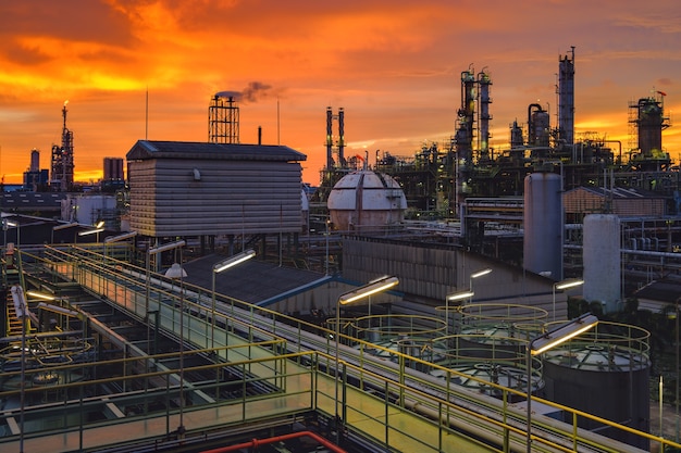 Petrochemical industry plant at sunset, Manufacturing of oil refinery industrial