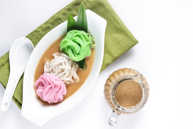 Petulo or Putu Mayang is Javanese steam cake made from rice 
 flour, served with ginger coconut milk