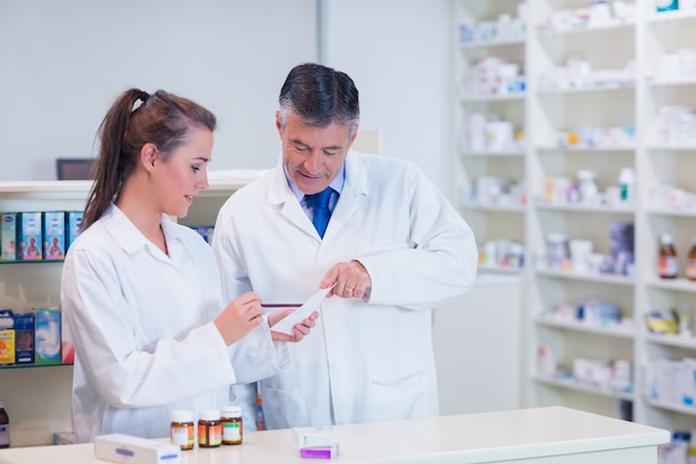 Pharmacist and his trainee working together