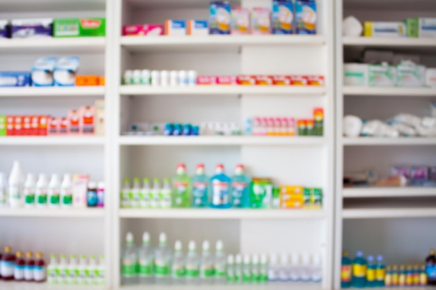 Photo pharmacy store with blur medicines arranged on shelves