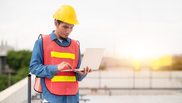 Philippines Asian man worker engineer working on rooftop factory plant