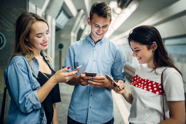 Phone addict youth using gadgets in subway, addiction problem, social addicted people, modern underground lifestyle