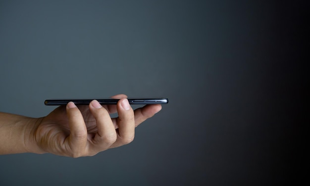 The phone is placed on the lid of the person's hand Communication technology concept