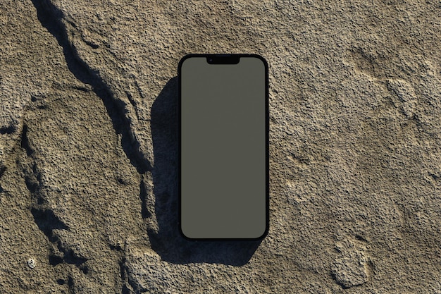 Phone laying on a rock outdoor mockup.