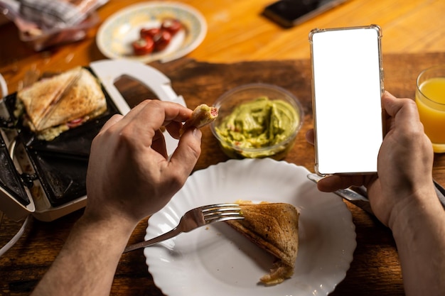 Photo phone mockup on the background of a plate of food rustic environment