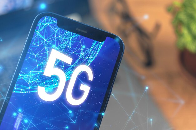 Phone with 5G network. Business desktop background. Concept photo of high speed internet, new generation of networks, data and connection, hologram on the screen close-up