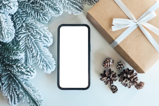 Phone with isolated screen on white background and Christmas decor