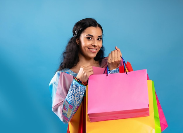 photo asian happy female woman girl holds colourful shopping packages