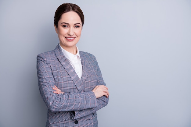 Photo of attractive charming confident business lady arms crossed beaming smile good mood skilled teacher occupation wear plaid suit jacket white shirt isolated grey color background