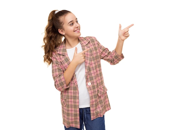 Photo of beautiful cute adorable smiling brunette teenage girl with ponytail in stylish plaid jacket