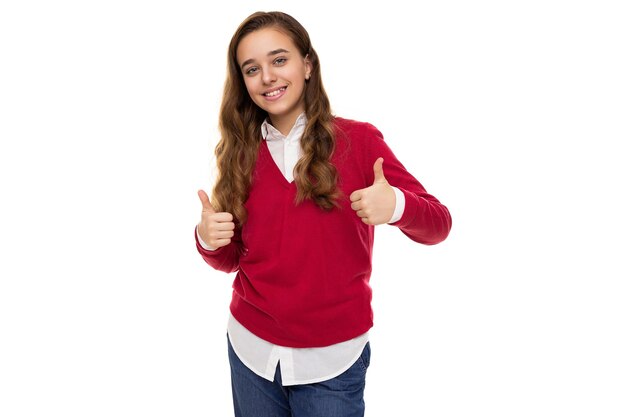 Photo photo of beautiful cute charming smiling brunette teenage girl with long hair in stylish red sweater